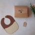 brown and cream baby bib package